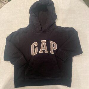 The Tommy Hilfiger Boys Small 6-7 Blue Striped Polo Shirt is a classic and styli